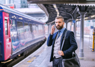 A man standing on a train platform